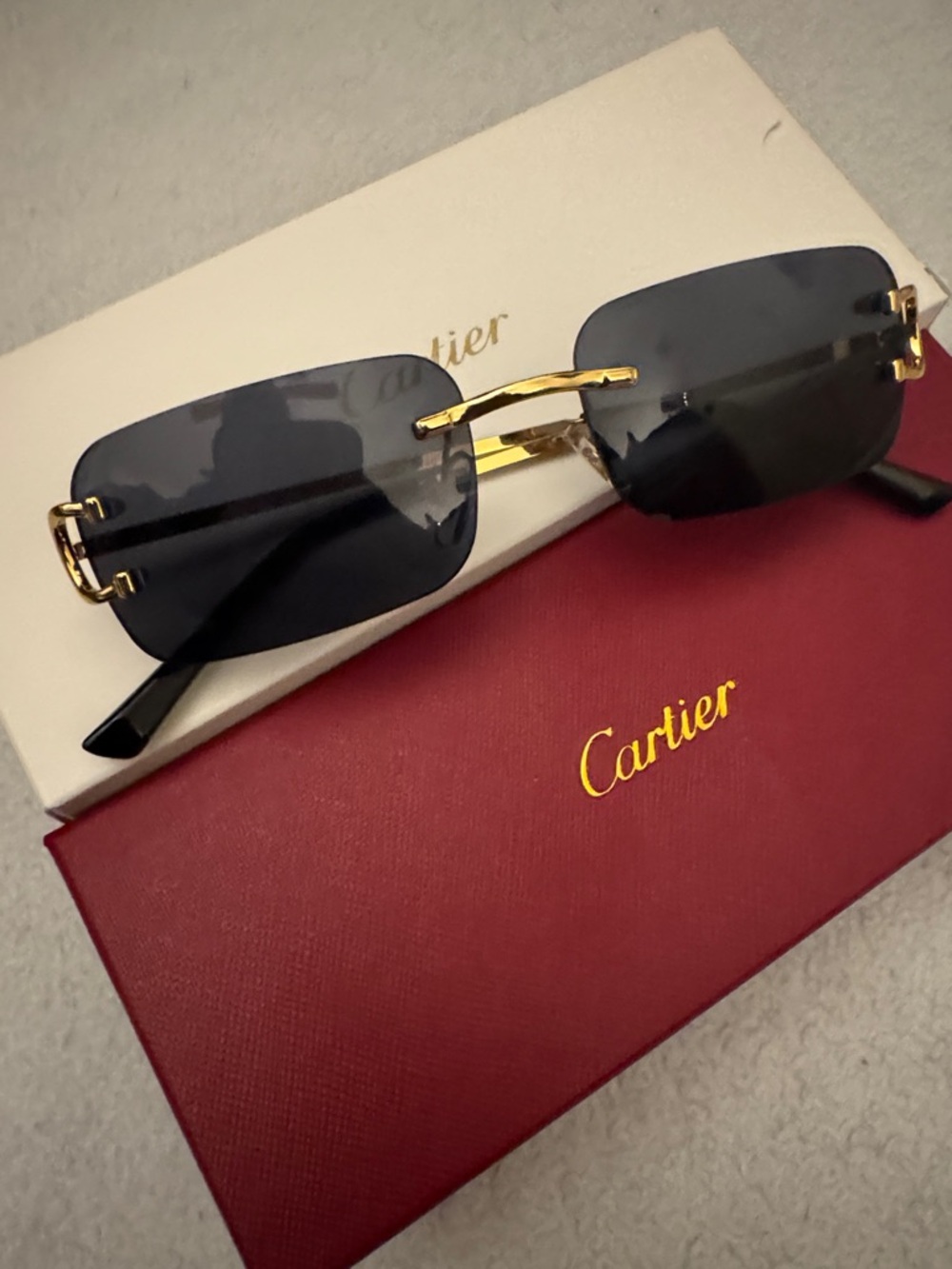 Cartier Men’s Rimless Sunglasses – Black Lenses with Gold Frame
